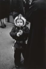 Kid in a hooded jacket aiming a gun, N.Y.C. 1957