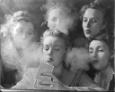 Members of the Young Women's Republican Club of Milford, Conn., explored the pleasures of tobacco, poker, the strip tease and such other "masculine" enjoyments. Here, the women play poker and smoke.